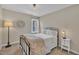 Bedroom features a metal bed frame with a decorative comforter and a vintage clock at 106 Ferris Wheel Ct, Cary, NC 27513