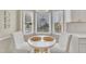 Cozy breakfast nook with bay windows, a small round table, and comfortable seating at 106 Ferris Wheel Ct, Cary, NC 27513