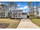 Well-kept home with a manicured lawn and convenient driveway leading to garage at 106 Ferris Wheel Ct, Cary, NC 27513