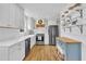 Bright, spacious kitchen with stainless steel appliances, white cabinets, wood floors, and ample counter space at 106 Ferris Wheel Ct, Cary, NC 27513