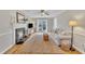 Cozy living room with a fireplace, hardwood floors, and natural light at 106 Ferris Wheel Ct, Cary, NC 27513