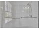 Bright shower features white subway tiles, clear glass door, and chrome shower fixtures at 106 Ferris Wheel Ct, Cary, NC 27513