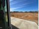 View of a spacious backyard area with a clear blue sky above at 106 Willow Cameron Way, Angier, NC 27501