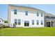 Two-story home with a green lawn and sliding glass doors at 106 Willow Cameron Way, Angier, NC 27501
