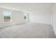 Expansive room with plush carpeting, recessed lights and bright, natural light from two large windows at 106 Willow Cameron Way, Angier, NC 27501