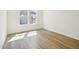 Bedroom with hardwood floors, large window, and white walls at 106 Willow Cameron Way, Angier, NC 27501