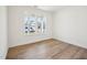 Bedroom with hardwood floors, two windows, and white walls at 106 Willow Cameron Way, Angier, NC 27501
