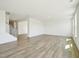 Spacious open-concept living area featuring light wood floors, a staircase, and lots of natural light at 106 Willow Cameron Way, Angier, NC 27501