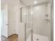 Modern bathroom features a glass shower with gray tile and built-in shelving at 106 Willow Cameron Way, Angier, NC 27501