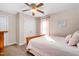 The bedroom features a light pink bedspread, ample storage space, and great natural light at 108 Galsworthy St, Cary, NC 27518