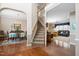 Inviting foyer with hardwood floors, staircase, and views into the dining and living rooms at 108 Galsworthy St, Cary, NC 27518