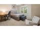 Cozy bedroom featuring natural light, carpet, and sitting area at 116 Wright Hill Dr, Durham, NC 27712