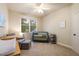 Bedroom with a large window, neutral walls, ceiling fan, and comfortable furnishings at 116 Wright Hill Dr, Durham, NC 27712