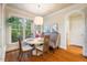 Cozy dining area featuring a large window and stylish furnishings for intimate gatherings at 116 Wright Hill Dr, Durham, NC 27712