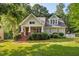 Charming cottage-style home featuring a brick porch and well-maintained landscaping at 116 Wright Hill Dr, Durham, NC 27712