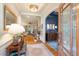 Elegant foyer with hardwood floors, ornate lighting, and a glimpse into the living spaces at 116 Wright Hill Dr, Durham, NC 27712