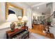 Welcoming foyer with hardwood floors and decorative lamps, leading to an open-concept living area at 116 Wright Hill Dr, Durham, NC 27712