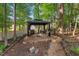Inviting gazebo in a wooded backyard setting, perfect for outdoor entertaining and relaxation at 116 Wright Hill Dr, Durham, NC 27712