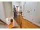 Upstairs hallway with hardwood floors, wood railing and access to rooms at 116 Wright Hill Dr, Durham, NC 27712