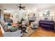 Comfortable living room featuring fireplace, piano, and hardwood floors at 116 Wright Hill Dr, Durham, NC 27712