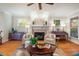 Inviting living room with fireplace, piano, and hardwood floors at 116 Wright Hill Dr, Durham, NC 27712