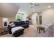 Spacious bonus room featuring neutral carpet, modern furniture, and natural light at 116 Wright Hill Dr, Durham, NC 27712