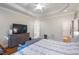 Bright main bedroom with ensuite bathroom, hardwood floors, and neutral color palette at 116 Wright Hill Dr, Durham, NC 27712