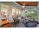 Relaxing screened-in porch with wood ceiling and view of the living room at 116 Wright Hill Dr, Durham, NC 27712