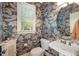Stylish powder room with patterned wallpaper, pedestal sink, and natural light at 116 Wright Hill Dr, Durham, NC 27712