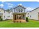Backyard features a wood deck with sliding glass door and a green lawn at 1211 Chaney Rd, Raleigh, NC 27606
