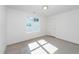 Bedroom with carpeted floors, window, and a ceiling fan at 1211 Chaney Rd, Raleigh, NC 27606