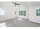 Bright bedroom with large windows and a ceiling fan at 1211 Chaney Rd, Raleigh, NC 27606