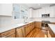 This kitchen offers stainless steel appliances, bright cabinets, and a stainless steel sink at 1211 Chaney Rd, Raleigh, NC 27606
