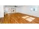 Spacious living room featuring hardwood floors, access to the outdoor patio, and natural light at 1211 Chaney Rd, Raleigh, NC 27606