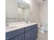 Bathroom with a double sink, modern vanity, tile floors, and a large mirror at 1245 Barreto Dr, Wendell, NC 27591
