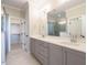 Bathroom featuring double vanity, stylish countertop, and walk-in shower at 1245 Barreto Dr, Wendell, NC 27591