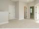 Spacious bonus room with plush carpet, neutral walls, and three doors for easy access at 1245 Barreto Dr, Wendell, NC 27591