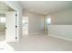 Bonus room boasts plush carpet and natural light from large windows for a bright space at 1245 Barreto Dr, Wendell, NC 27591