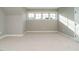 Bonus room features plush carpet, natural light from windows, and versatile space at 1245 Barreto Dr, Wendell, NC 27591
