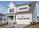Charming two-story home with a two-car garage, covered porch, and meticulous landscaping at 1245 Barreto Dr, Wendell, NC 27591