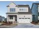 Charming two-story home with a two-car garage, covered porch, and meticulous landscaping at 1245 Barreto Dr, Wendell, NC 27591