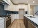 Well-designed kitchen with stainless steel appliances, white cabinets, and spacious island with a sink at 1245 Barreto Dr, Wendell, NC 27591