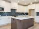Modern kitchen with white cabinets, quartz countertops, stylish backsplash, and stainless steel appliances at 1245 Barreto Dr, Wendell, NC 27591