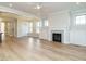 Open concept living area with a fireplace and seamless transition to the kitchen at 1245 Barreto Dr, Wendell, NC 27591