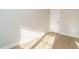 Clean room with hardwood floors, white trim, and neutral walls, ready for your personal touch at 1245 Barreto Dr, Wendell, NC 27591