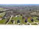 Aerial view of neighborhood homes, showcasing their location and surrounding landscape at 1318 Reading Ct, Burlington, NC 27217