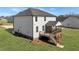 Spacious backyard with a white siding home and a charming screened-in porch at 1318 Reading Ct, Burlington, NC 27217