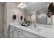 Bright bathroom featuring double sinks and a large mirror, designed for convenience and style at 1318 Reading Ct, Burlington, NC 27217