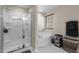 Elegant bathroom with a glass-enclosed shower, corner bathtub, and tasteful decor for a spa-like experience at 1318 Reading Ct, Burlington, NC 27217