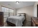 Bright bedroom with natural light, a wooden bed frame, and soft gray bedding at 1318 Reading Ct, Burlington, NC 27217